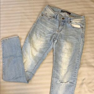 Blue jeans with slit at knee level